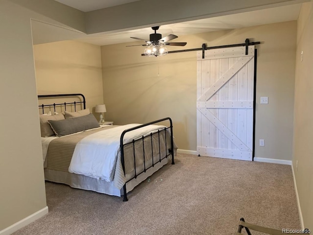 23580 E Portland Way, Aurora, CO 80016 - carpeted bedroom featuring baseboards, a barn door, and a ceiling fan