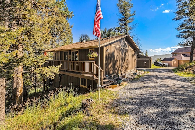 view of side of property with a deck