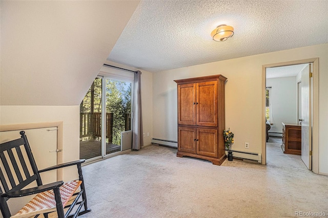 interior space featuring a baseboard radiator, baseboard heating, and light colored carpet