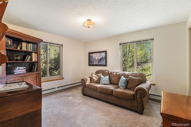 carpeted living area featuring a baseboard radiator and a textured ceiling