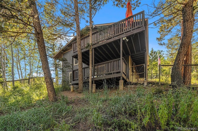 back of house with a wooden deck