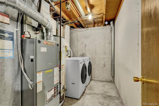 clothes washing area featuring laundry area and separate washer and dryer