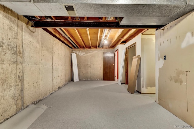 unfinished basement featuring visible vents