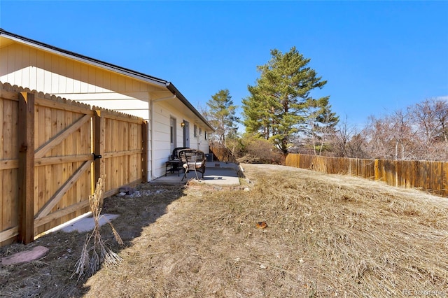 view of yard featuring a patio area and fence