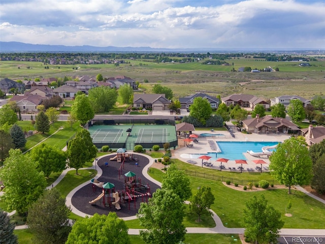 7992 Rising Sun Ct, Windsor, CO 80550 - aerial view of residential area with a pool and a mountain backdrop
