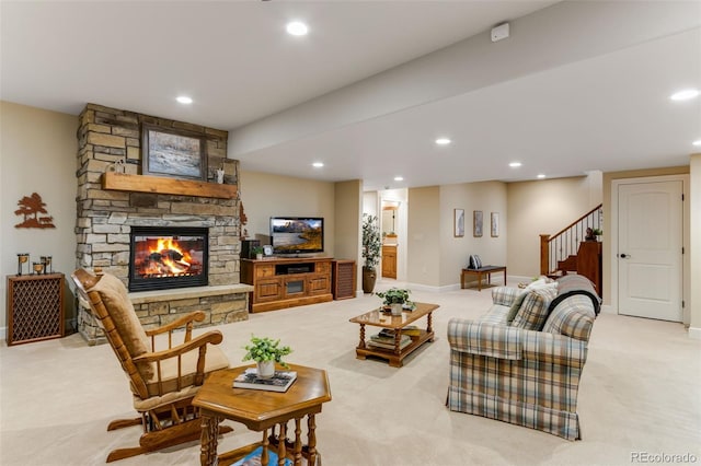 7992 Rising Sun Ct, Windsor, CO 80550 - living area with light carpet, stairs, recessed lighting, a stone fireplace, and baseboards