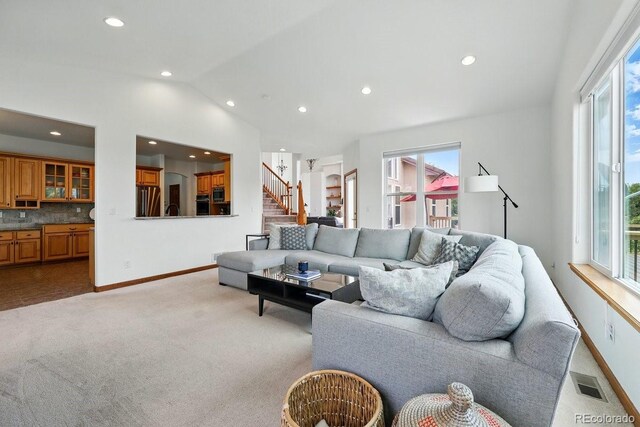 3 Desert Inn Way, Colorado Springs, CO 80921 - living room featuring light carpet, recessed lighting, vaulted ceiling, baseboards, and stairway