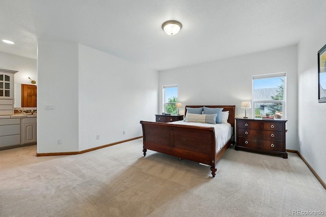 3 Desert Inn Way, Colorado Springs, CO 80921 - bedroom with multiple windows, light carpet, and baseboards