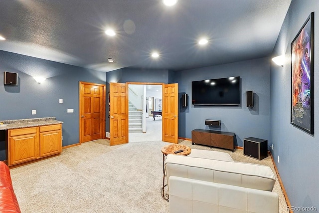 3 Desert Inn Way, Colorado Springs, CO 80921 - living area with light colored carpet, baseboards, recessed lighting, and stairway