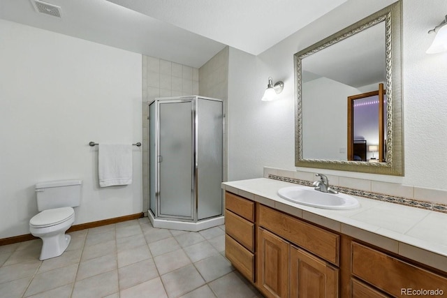 3 Desert Inn Way, Colorado Springs, CO 80921 - bathroom with a shower stall, vanity, toilet, and tile patterned flooring