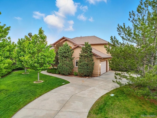3 Desert Inn Way, Colorado Springs, CO 80921 - view of front of house with driveway, stucco siding, a garage, a front lawn, and a tile roof