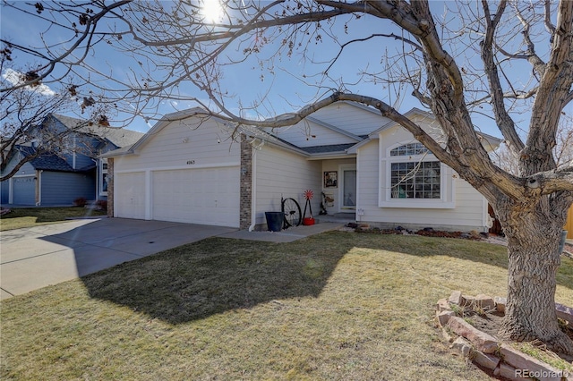 view of front facade featuring an attached garage, a front lawn, and concrete driveway