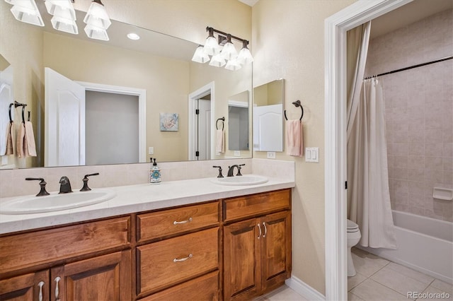 8526 E 35th Ave, Denver, CO 80238 - full bathroom featuring double vanity, tile patterned flooring, and shower / tub combo