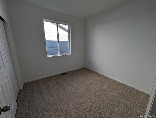 view of carpeted spare room