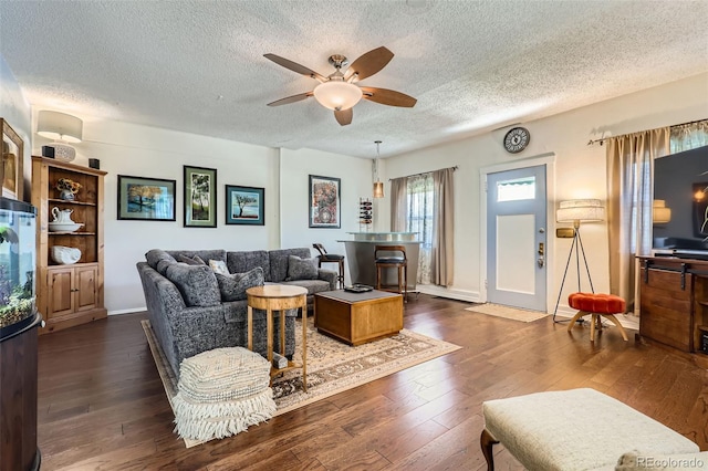 1559 Elm St, Denver, CO 80220 - living area with a textured ceiling, ceiling fan, dark wood-type flooring, and baseboards