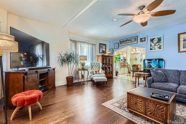 1559 Elm St, Denver, CO 80220 - living room featuring a textured ceiling, a chandelier, a ceiling fan, and wood finished floors