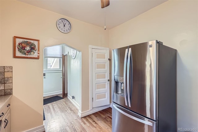 1559 Elm St, Denver, CO 80220 - kitchen featuring stainless steel refrigerator with ice dispenser, light wood-style floors, and light countertops
