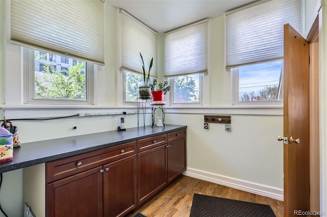 1559 Elm St, Denver, CO 80220 - laundry area featuring light wood-style flooring, plenty of natural light, and baseboards