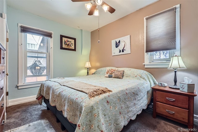 1559 Elm St, Denver, CO 80220 - carpeted bedroom with multiple windows, baseboards, and a ceiling fan