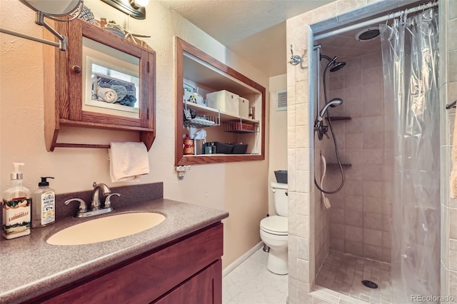 1559 Elm St, Denver, CO 80220 - bathroom with toilet, vanity, and tiled shower