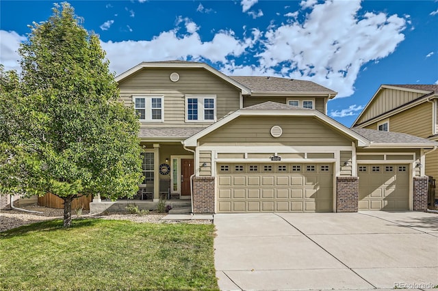 view of front of home featuring a front yard and a garage