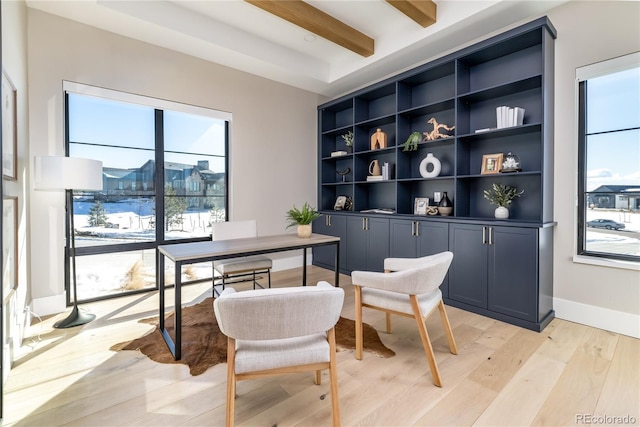 home office featuring beam ceiling and light hardwood / wood-style flooring