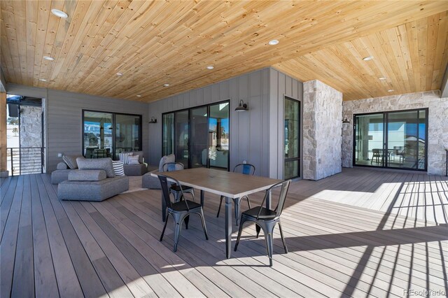 wooden deck with an outdoor living space