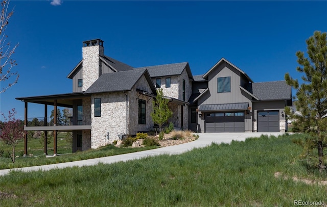 2442 Fox View Trl, Franktown, CO 80116 - view of front of home with stone siding, a garage, a chimney, a balcony, and driveway