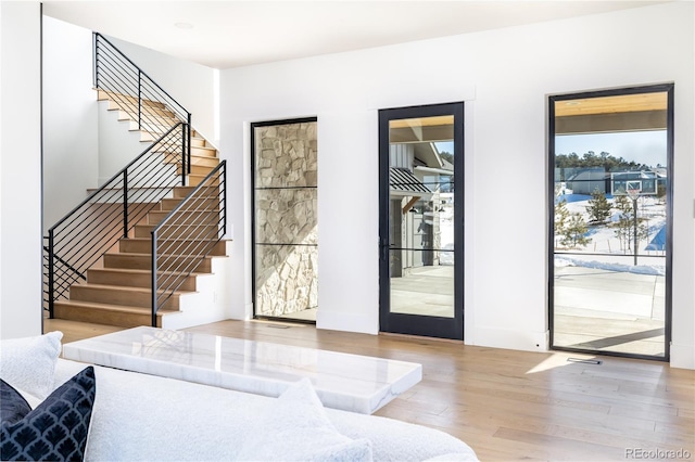 2442 Fox View Trl, Franktown, CO 80116 - foyer with wood finished floors, stairs, and baseboards