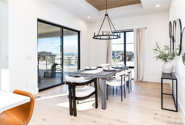 2442 Fox View Trl, Franktown, CO 80116 - dining space featuring a chandelier, light wood-style flooring, baseboards, a raised ceiling, and recessed lighting