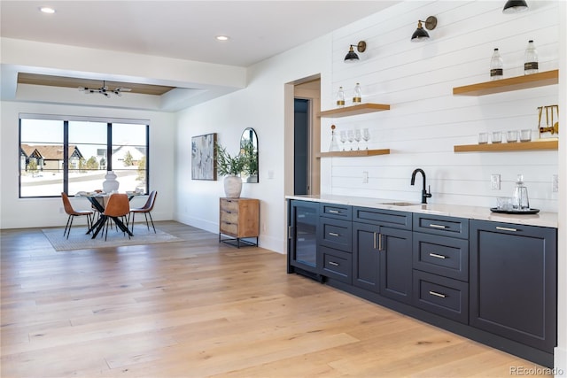 2442 Fox View Trl, Franktown, CO 80116 - indoor wet bar featuring beverage cooler, light wood finished floors, recessed lighting, baseboards, and a chandelier