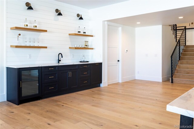 2442 Fox View Trl, Franktown, CO 80116 - indoor wet bar with light wood finished floors, stairway, and recessed lighting