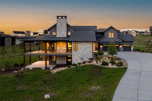2442 Fox View Trl, Franktown, CO 80116 - view of front of house featuring stone siding, board and batten siding, a front lawn, a chimney, and a shingled roof