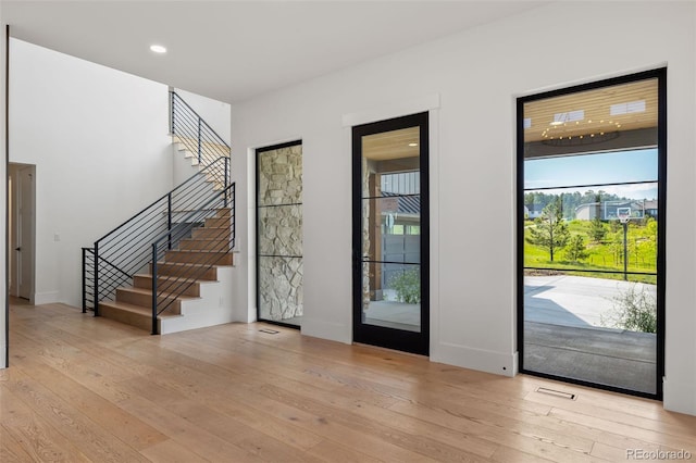 2442 Fox View Trl, Franktown, CO 80116 - foyer featuring stairway, light wood-style floors, and recessed lighting