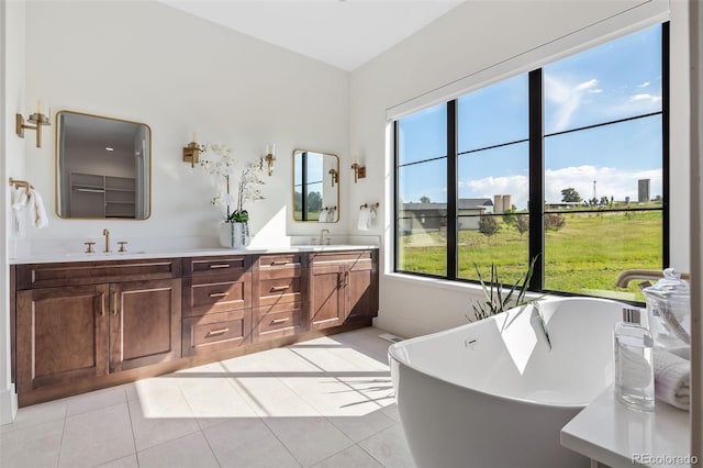 2442 Fox View Trl, Franktown, CO 80116 - full bath featuring double vanity, a freestanding bath, and tile patterned flooring