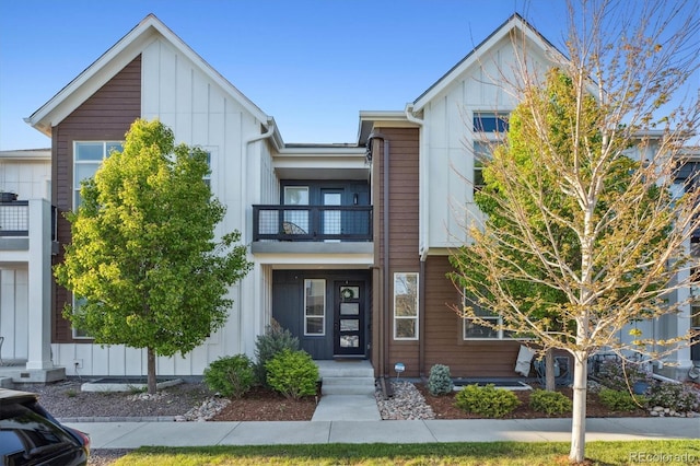 10165 E 59th Ave, Denver, CO 80238 - view of front of house featuring a balcony and board and batten siding