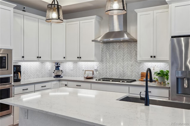 10165 E 59th Ave, Denver, CO 80238 - kitchen featuring decorative backsplash, white cabinets, and stainless steel appliances