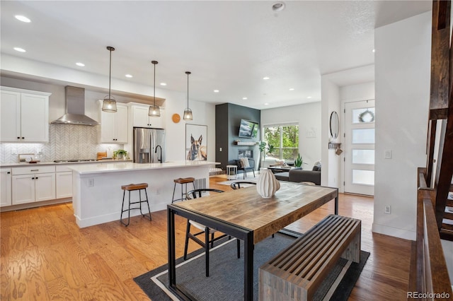 10165 E 59th Ave, Denver, CO 80238 - dining area with light wood finished floors and recessed lighting