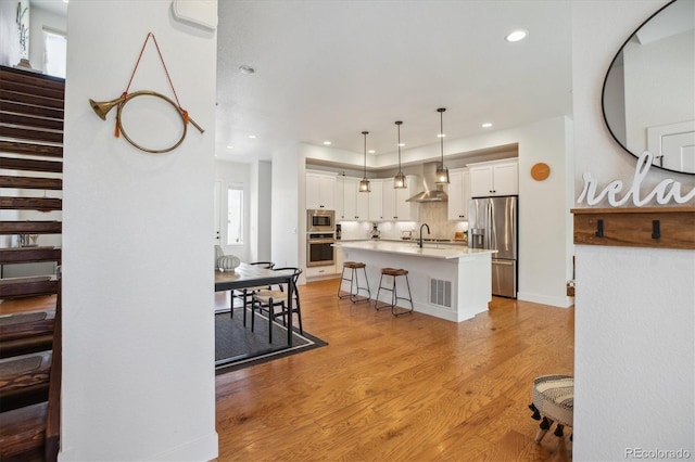 10165 E 59th Ave, Denver, CO 80238 - dining space featuring light wood-style floors, stairway, visible vents, and recessed lighting