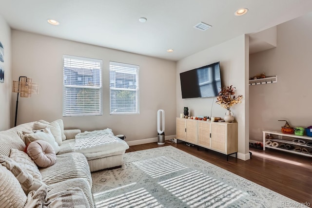 living room with dark hardwood / wood-style flooring