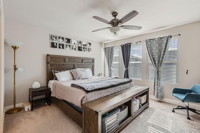 bedroom with light carpet and ceiling fan