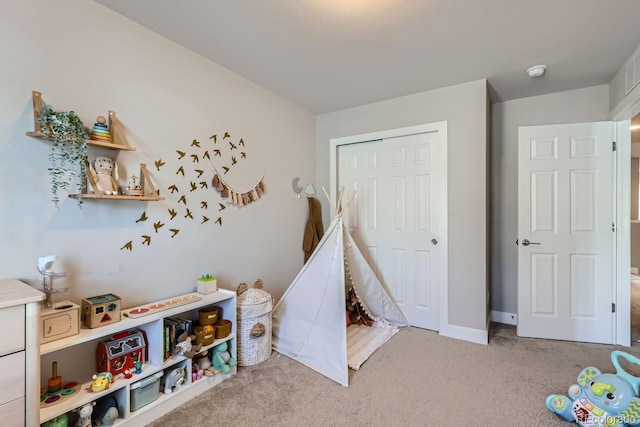 playroom featuring light carpet