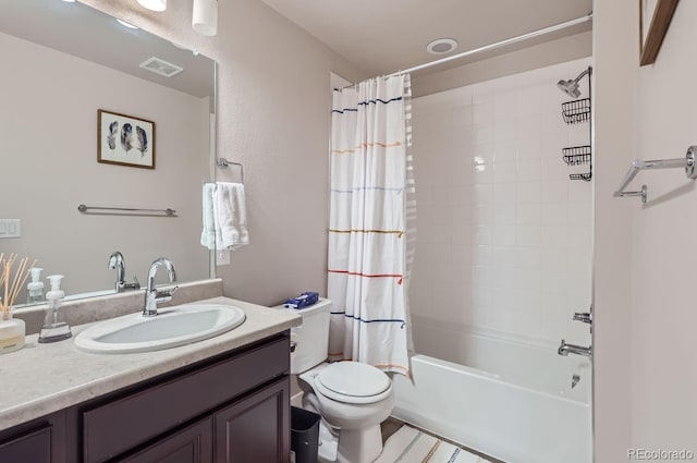 full bathroom with vanity, shower / tub combo, and toilet