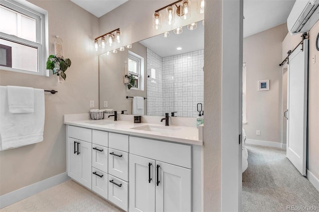 full bathroom featuring an AC wall unit, a stall shower, plenty of natural light, and a sink