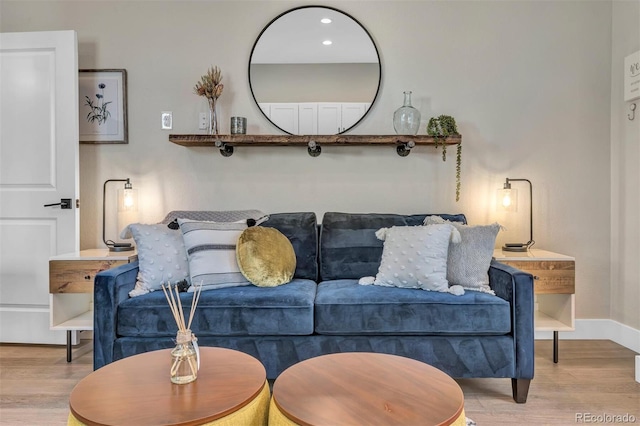 living area with recessed lighting, wood finished floors, and baseboards