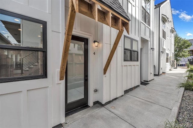 entrance to property featuring board and batten siding