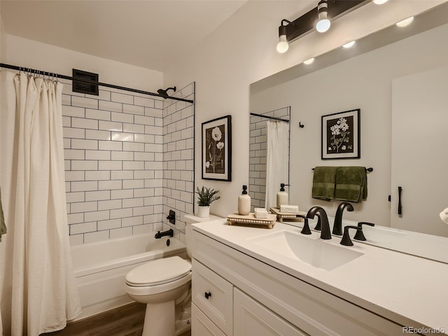 full bathroom with hardwood / wood-style floors, shower / bath combination with curtain, toilet, and vanity