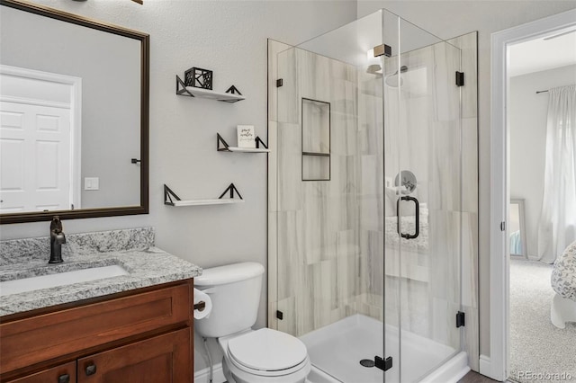 6464 Elsinore Dr, Colorado Springs, CO 80923 - full bathroom featuring toilet, a shower stall, and vanity