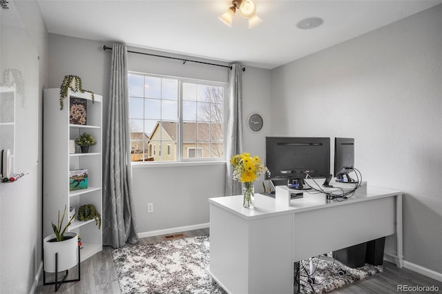 6464 Elsinore Dr, Colorado Springs, CO 80923 - home office with baseboards and wood finished floors