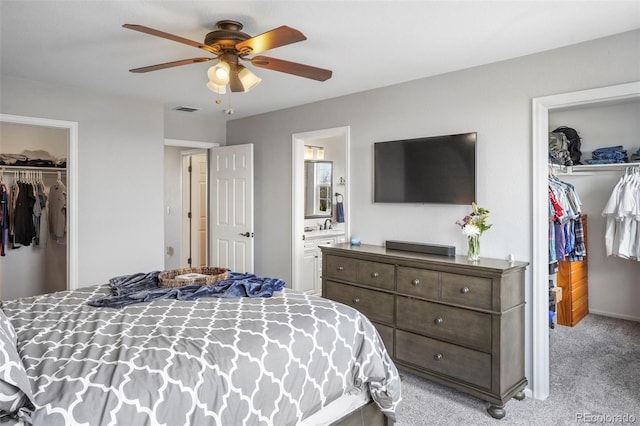6464 Elsinore Dr, Colorado Springs, CO 80923 - bedroom featuring a closet, a walk in closet, and light colored carpet